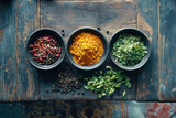 A collection of bowls filled with various Indian spices and herbs like turmeric, cumin, and coriander, arranged on a rustic wooden background, offering a rich, aromatic, traditional vibe