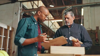 Aufkleber - Men, carpenter and clipboard at factory, discussion or review with planning, design and project management. People, checklist and question with feedback, creativity or advice for woodwork in workshop
