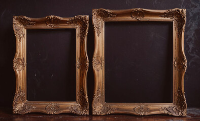 Poster - Two gold framed picture frames sit on a table. The frames are empty, and the table is dark