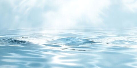Poster - Soft sunlight creates gentle ripples on a light blue water surface, resulting in a warm, abstract scene