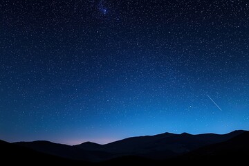Wall Mural - shooting stars streak across a deep blue night sky, illuminating the silhouettes of mountains on the