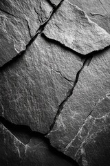 Poster - Dramatic close up of fractured slate stone surface showcasing texture and contrast in a monochromatic palette creating a captivating geological pattern