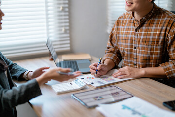 Poster - Business partners working together, reviewing financial charts and graphs during a productive meeting in the office