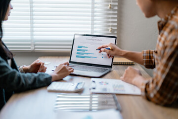 Fototapete - Business people working together on marketing strategy using laptop and documents on desk