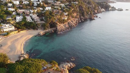 Wall Mural - Stunning Aerial View of a Serene Beach and Scenic Cliffside Homes by the Blue Ocean. Perfect for Relaxation and Vacation Inspiration.