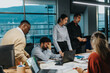 © qunica.com - Group of business people engage in collaborative brainstorming in a contemporary office setting, highlighting teamwork, innovative ideas, and creativity. Various ages and ethnicities represented.