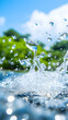 © NANDACHOIRUR - Splashing water, blue sky, green trees, and bright natural outdoor setting