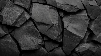 Poster - A black rock wall with jagged edges