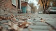 © Yalexai - Autumn leaves on cobblestone street captivating urban scene with warm tones and rustic charm in a quiet neighborhood