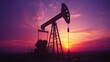 © Almahyra - Silhouette of oil pump jack at sunset.