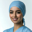 © Kootenay - Smiling Nurse in Blue Scrubs and Surgical Cap: Professional Female Healthcare Worker Portrait
