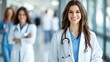© mlangsen - Smiling doctor leads team in hospital hallway, focused on providing care