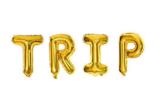 TRIP – Golden foil balloons spelling 