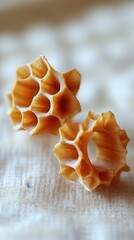 Poster - Honeycomb inspired geometric structures on textured fabric surface showcasing intricate design and light play creating a warm inviting mood