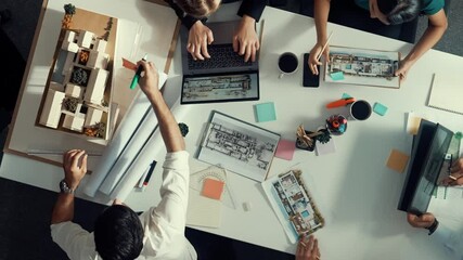 Poster - architect team discussing and pointing and presenting blueprint to interior designer. aerial view pr