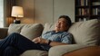 © ULTRA STOCK'S - Asian mature man lying down on comfort sofa in living room at home