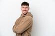 © luismolinero - Young caucasian handsome man isolated on white background with arms crossed and happy