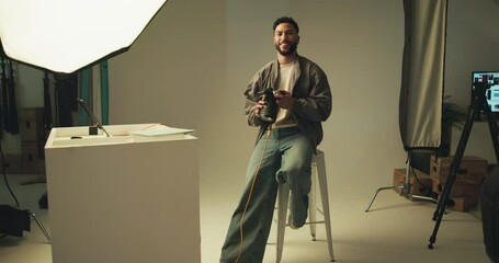 Poster - Face, man and photographer on camera in studio of photoshoot, about us and catalog. Portrait, person and digital of photography career in backstage, picture production and magazine industry
