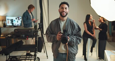 Poster - Face, photographer and smile with man on set for fashion magazine or style photoshoot. Camera, direction or production with photography person behind the scenes for artistic or creative catalog