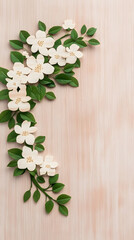 Aufkleber - A delicate arrangement of white flowers and green leaves on a textured background, creating a fresh and natural aesthetic