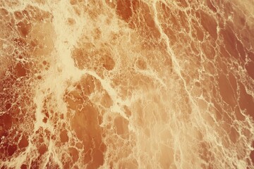 Wall Mural - natural ocean waves with foam patterns in warm tones