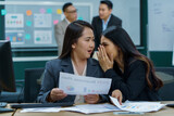 group of asian office worker woman talking or whispering gossip with colleague rumors to coworker in office