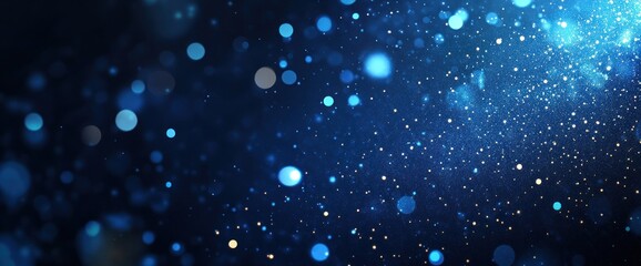 Poster - Abstract blue bokeh background with glowing particles and sparkles.