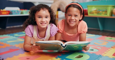 Poster - Education, classroom and face of children with book for learning, development or story time. Happy, friends and girl students reading novel on floor for literacy knowledge at elementary school.