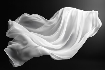 Poster - A white fabric gracefully floats in the air with soft waves and a smooth texture, set against a dark backdrop creating a sense of tranquility