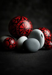 Poster - Decorative painted stones in various sizes and colors on a dark background