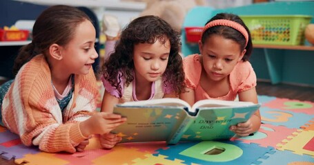 Poster - Education, friends and kids with book in classroom for learning, development or story time. Children, relax and girl students reading novel on floor for literacy knowledge at elementary school.