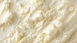 © Kittichet - Creamy Spreadable Butter Texture Close-Up on Neutral Background