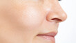 © Juiy - Close up of woman face showing smooth skin texture and natural complexion