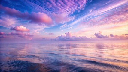 Aufkleber - A pastel sky with cotton candy clouds reflects in the rippling surface of the ocean, creating a serene and ethereal scene.