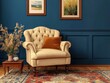 © RaksaLinggo - A comfortable beige armchair sits near a decorated blue wall
