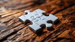 © Ali - White puzzle pieces connect on wood