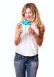 © Eric Hood - Pretty blond woman, 20s, with small gift box, blue bow, isolated on white background