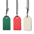 © AshrofS - Three colorful tags hang from black strings, featuring green, red, and cream colors, ideal for labeling gifts or items.