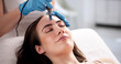 © Andrey Popov - Dr. Smith Performing Microneedling Mesotherapy on Young Woman