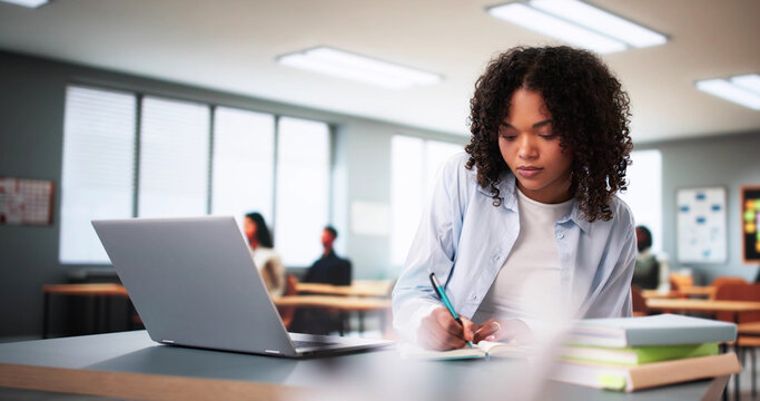 Student Girl In Classroom Using Laptop