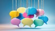 © NeuralNiche - Colorful speech bubbles for communication hanging from a cord against a blue background.