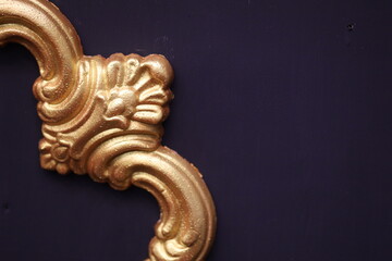 Poster - A detailed shot of a luxurious gold door handle.