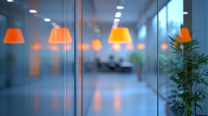 Poster - A contemporary office environment features sleek glass walls and stylish orange lamps illuminating the space. Lush greenery adds a touch of nature, promoting creativity and calm