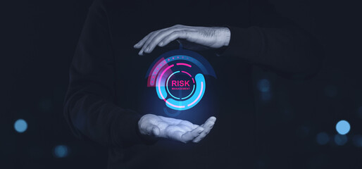 Poster - Hands holding digital risk management interface on dark background.