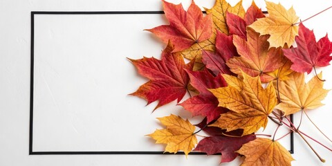 Poster - A black frame surrounding a cluster of vibrant autumn leaves, a minimalist background for your creative ideas.