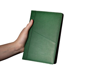 Poster - Holding a green notebook planner, daily agenda for scheduling and organizing events. Business, office, and meeting reminder concept. Isolated on white background..