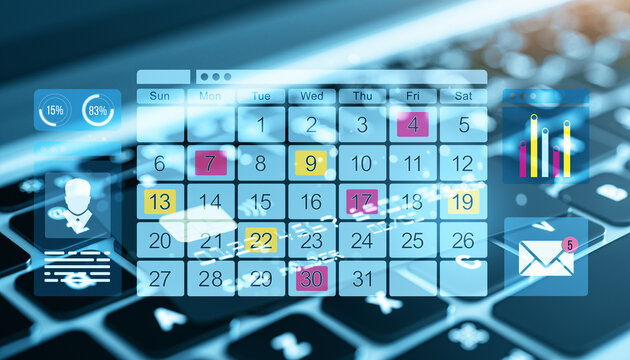 Digital calendar on computer screen with business graphics.