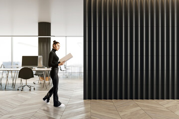 Aufkleber - Businesswoman in modern office interior with black wall and wooden floor.