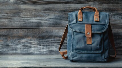 Poster - A classic canvas backpack with a vintage design, placed on a rustic wooden surface.