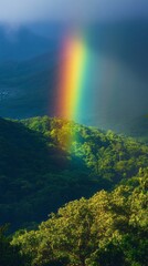 Poster - Rain yields to sunlight, casting a radiant rainbow over the lush mountains, illuminating the greenery below. The serene valley transforms into a canvas of colors, creating a peaceful atmosphere